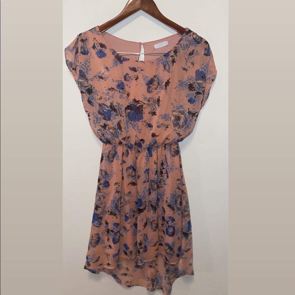 Flowy orangish/pinkish dress with blue flowers